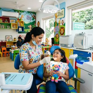 Pediatric dentist treating a child in a friendly dental clinic in Jayanagar Bengaluru